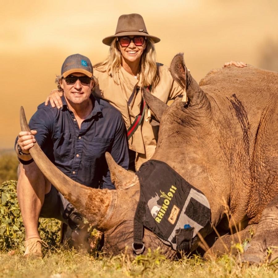 Greg and Riana Lederle with a white rhino during a Rhino 911 conservation operation
